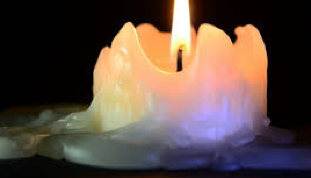 A free-standing candle burns down to a puddle of wax or sets in runs down the side of the candle